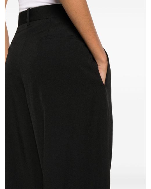 The Row Black Extra-long Wide-leg Trousers