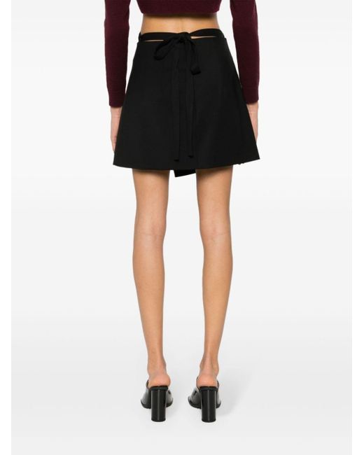 Minifalda con diseño cruzado Patou de color Black