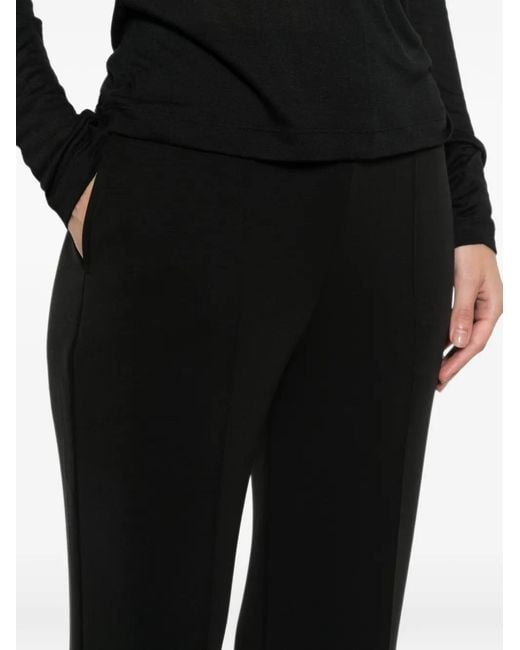 Woc Black Pressed-Crease Flared Trousers