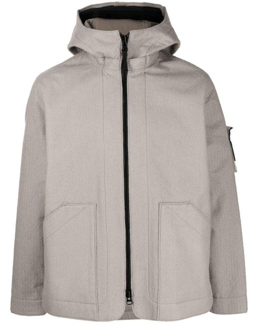 Chaqueta reflectante perforada Stone Island de hombre de color Gris