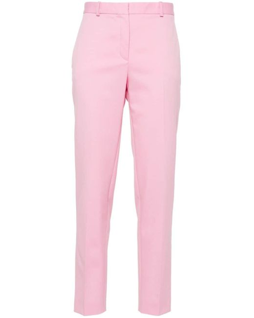 Pantalones ajustados con pinzas Versace de color Pink