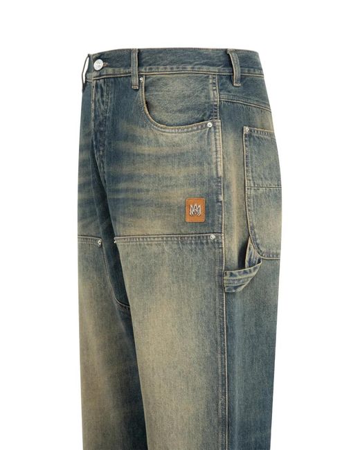 Amiri Blue Faded Panelled Jeans for men