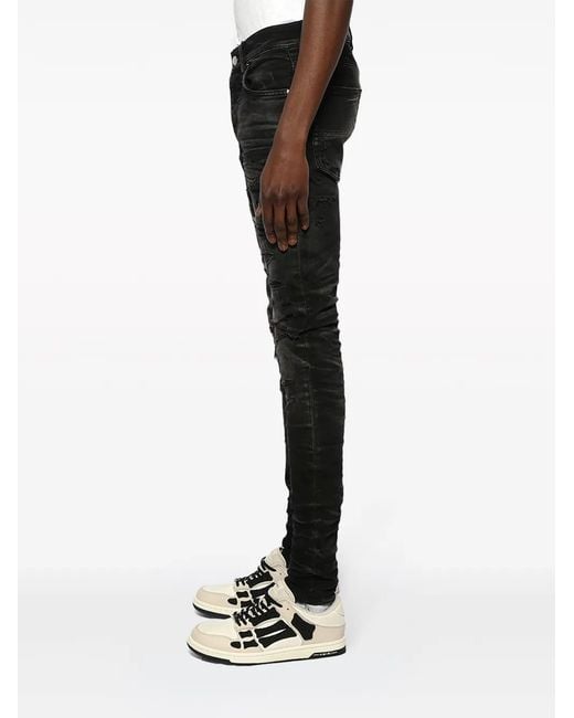 Amiri Black Logo-Patch Distressed Skinny Jeans for men