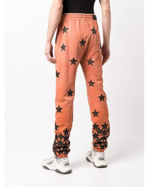 Amiri Orange Chemist Star Track Pants for men