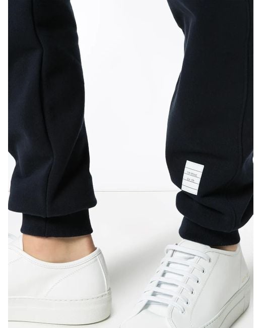 Pantalones de chándal con detalle de rayas Thom Browne de hombre de color Blue