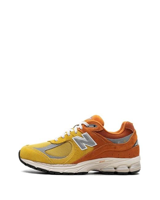 New Balance Orange 2002R Sneakers Mit Schnürung