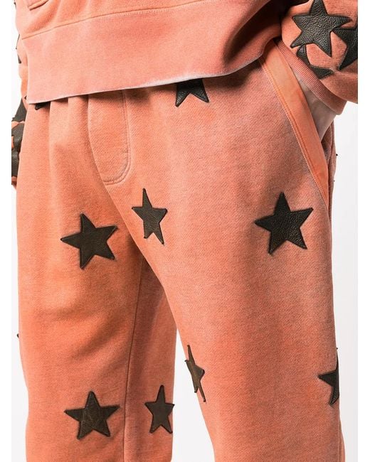 Amiri Orange Chemist Star Track Pants for men