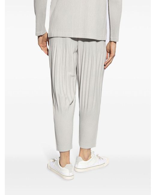 Homme Plissé Issey Miyake White Plissé Tapered Trousers for men