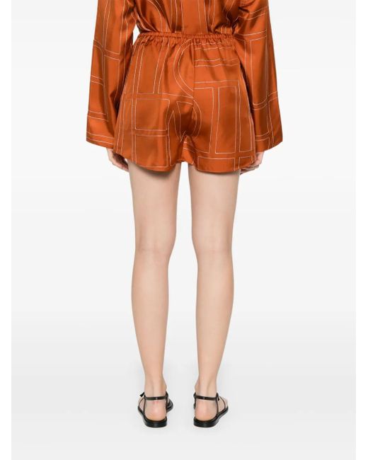 Totême  Orange Monogram silk shorts