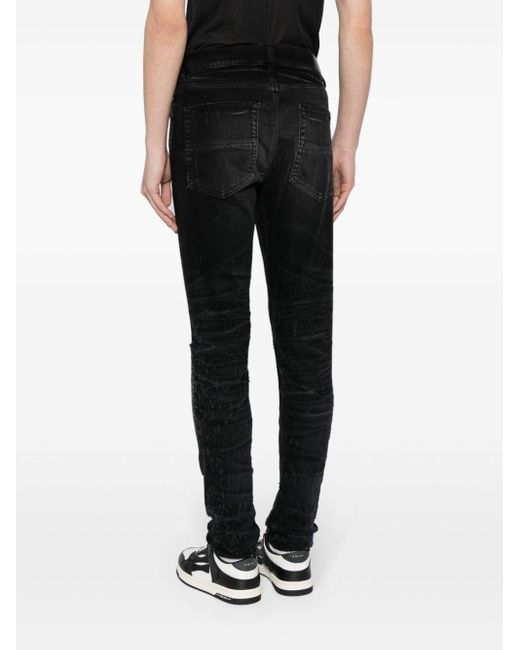 Jeans slim con decorazione di Amiri in Black da Uomo