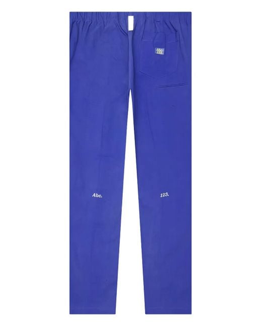 Advisory Board Crystals Blue Logo-Patch Trousers for men