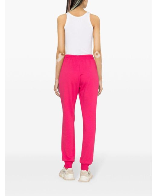 Pantalon de jogging à logo brodé Versace en coloris Pink