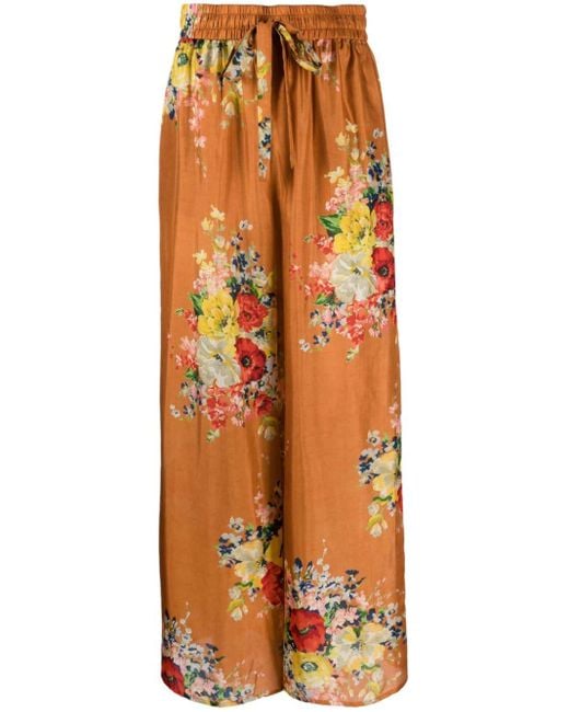 Pantaloni a vita alta con stampa floreale e gamba larga di Zimmermann in Orange