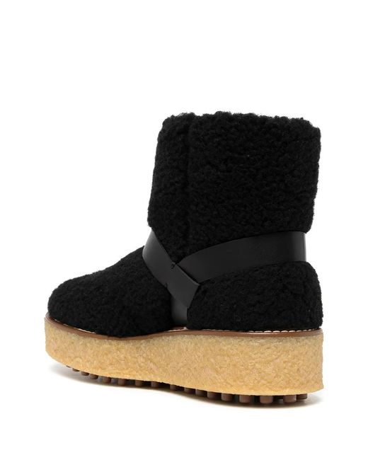 Tod's Black Platform Shearling Ankle Boots