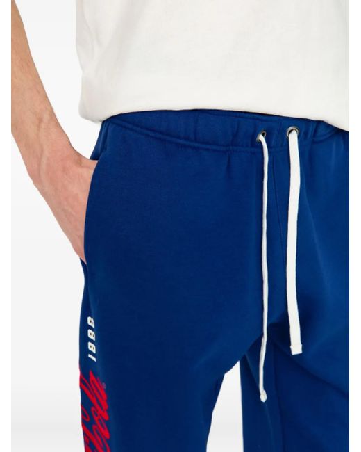メンズ Champion X Coca-cola ロゴ トラックパンツ Blue