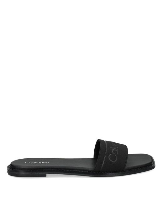 Sandalias con tira elástica y logo Calvin Klein de color Black