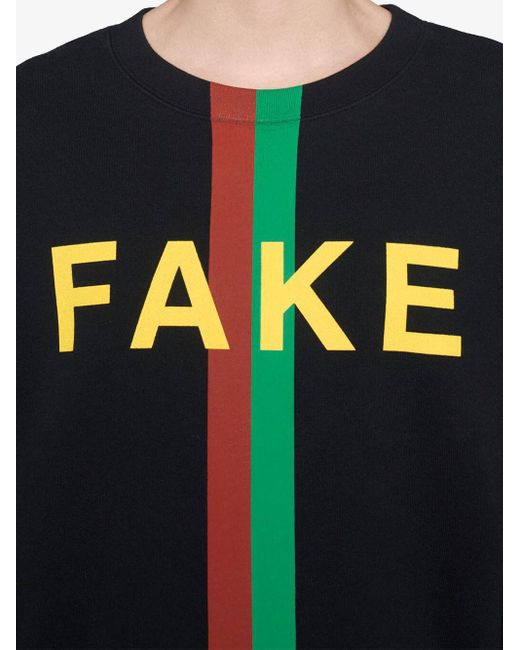 Felpa con stampa 'Fake/Not' di Gucci in Black da Uomo