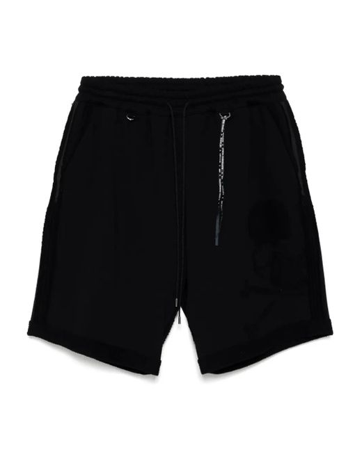 MASTERMIND WORLD Black Cut-Off Track Shorts for men