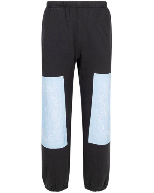 Pantaloni sportivi con motivo bandana x The North Face di Supreme in Blue
