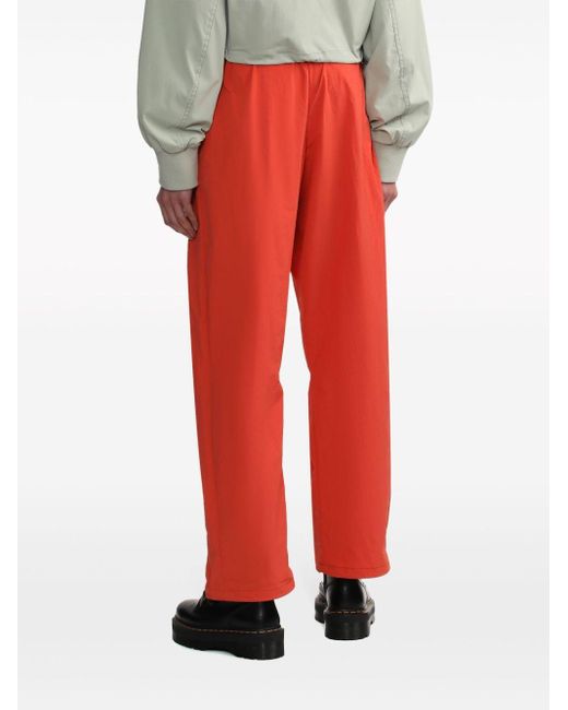 Pantalon de jogging droit à logo brodé Izzue en coloris Red