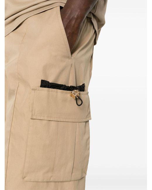 Pantalon en coton à poches cargo Versace pour homme en coloris Natural
