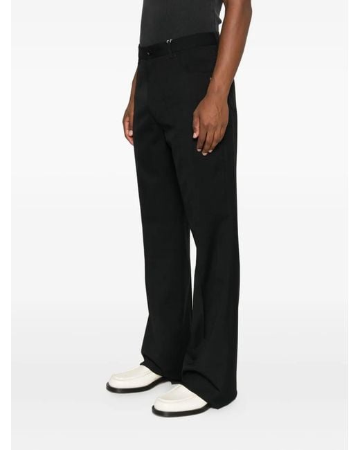 Amiri Black Button-Fly Bootcut Trousers for men
