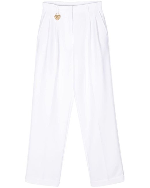 Pantalones de vestir con botones y diseño de corazón Moschino de color White