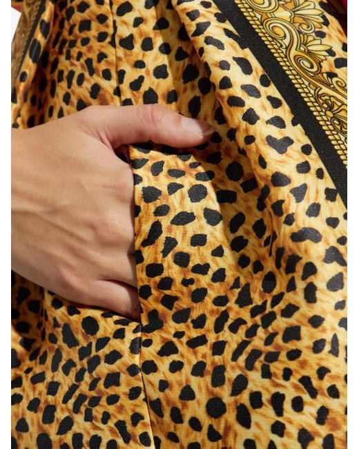 Minijupe À Design Plissé Versace en coloris Yellow