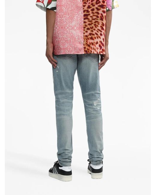 Amiri Blue Logo-Print Distressed Jeans for men