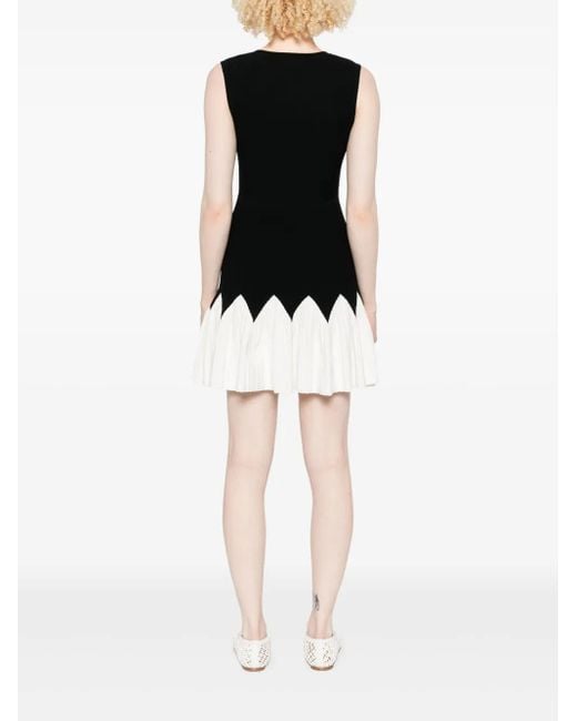 Vestido corto de punto Sandro de color Black
