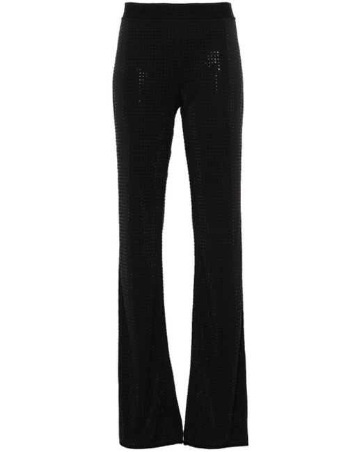 Pantaloni svasati con strass di Versace in Black