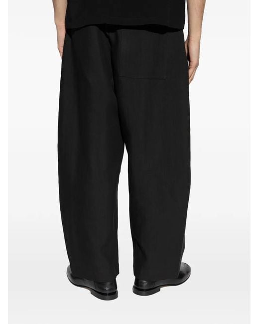 Studio Nicholson Black Ellis Pleated Trousers for men