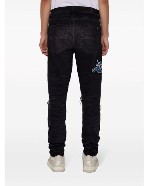 Jeans skinny MX1 di Amiri in Black da Uomo