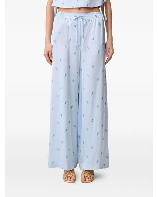 Pantalones palazzo con motivo floral Claudie Pierlot de color Blue
