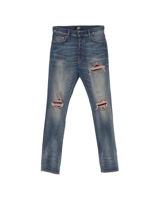 Amiri Blue Distressed Patchwork Jeans for men