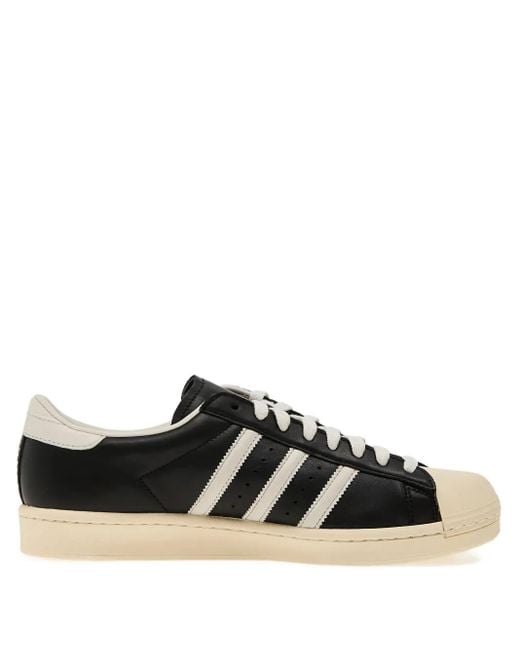 Sneakers Superstar Con Righe di Adidas in Black