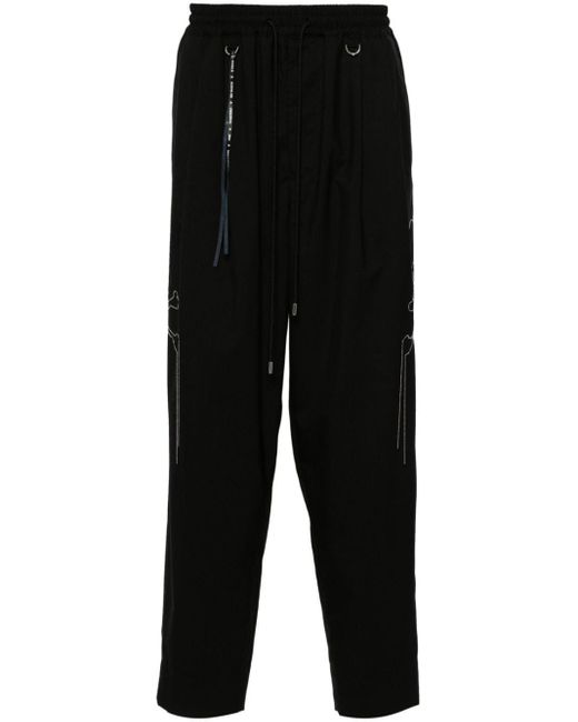 Pantaloni con decorazione di Mastermind Japan in Black da Uomo