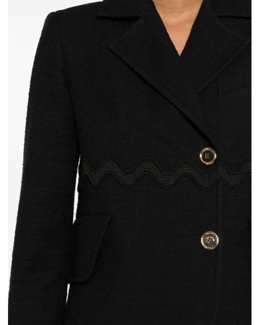 Veste en tweed à bords ondulés Patou en coloris Black
