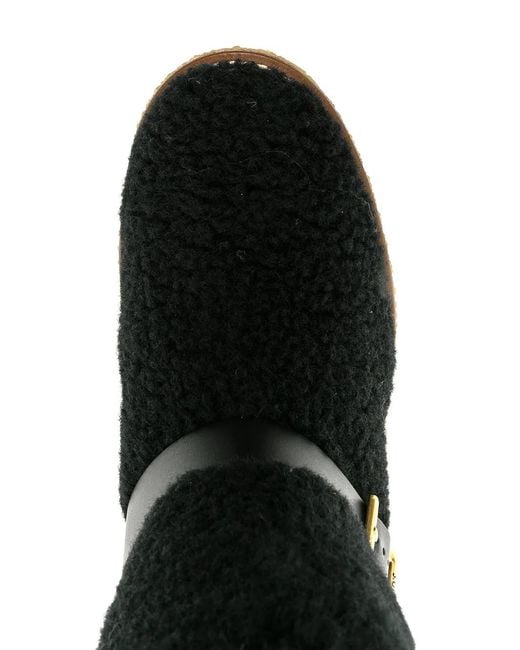 Tod's Black Platform Shearling Ankle Boots