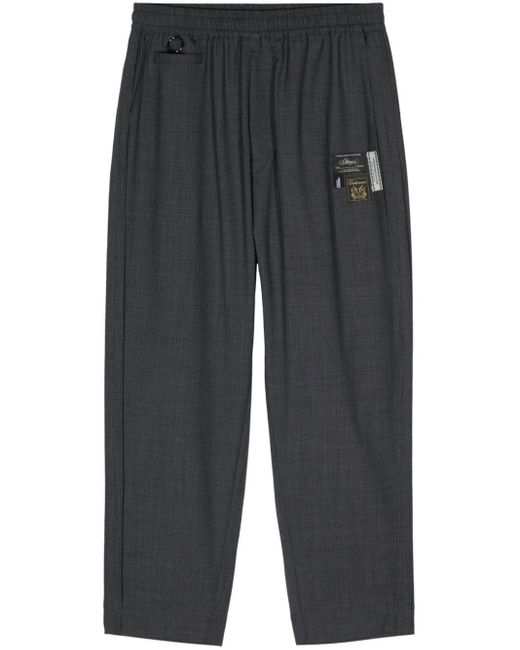 Pantaloni dritti con applicazione logo di Undercover in Gray