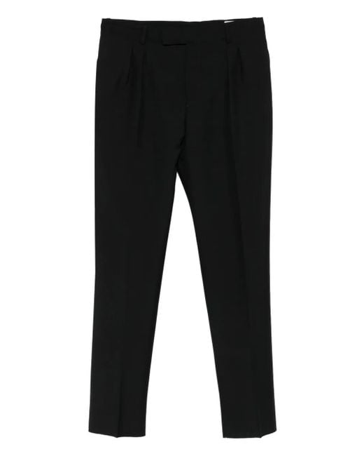 Pleated-front wool trousers Alexander McQueen de hombre de color Black