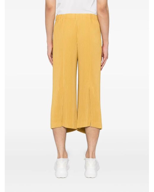 Homme Plissé Issey Miyake Yellow Mc June Pleated Trousers for men