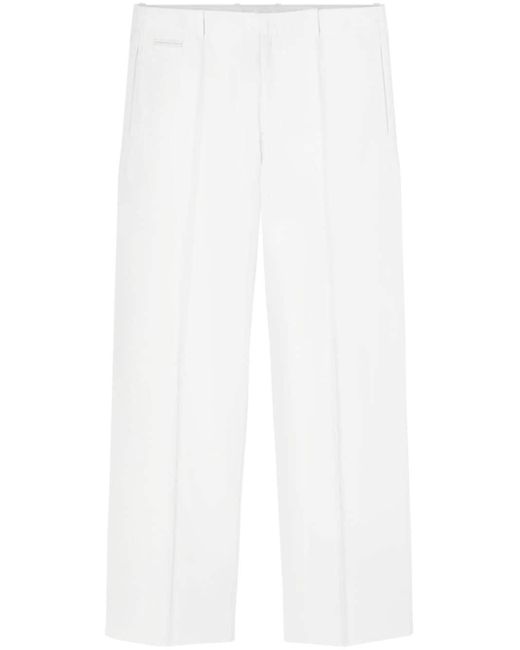 Pantalon de costume en cuir grainé Versace pour homme en coloris White