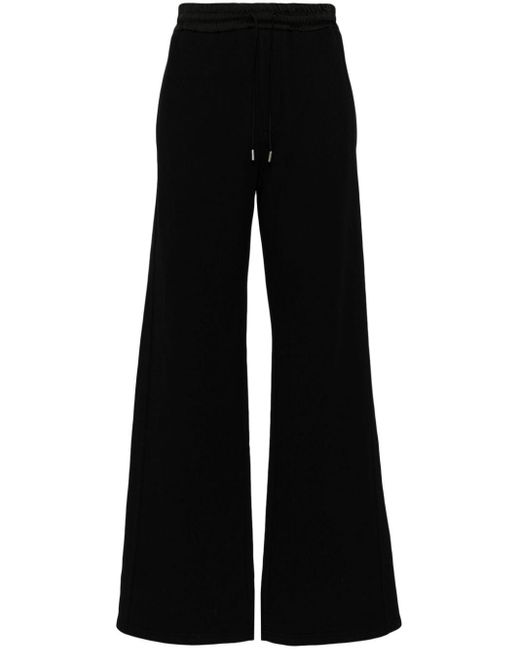 Wide-leg cotton track pants di Saint Laurent in Black da Uomo