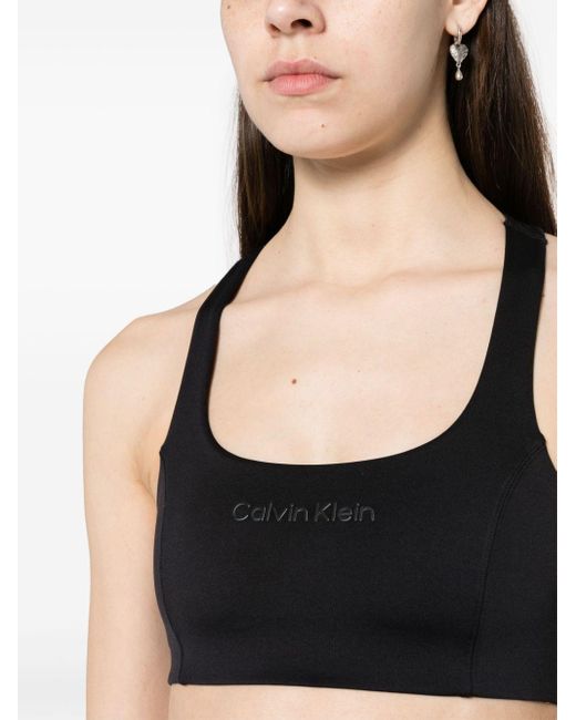 Brassière de sport à logo appliqué Calvin Klein en coloris Black