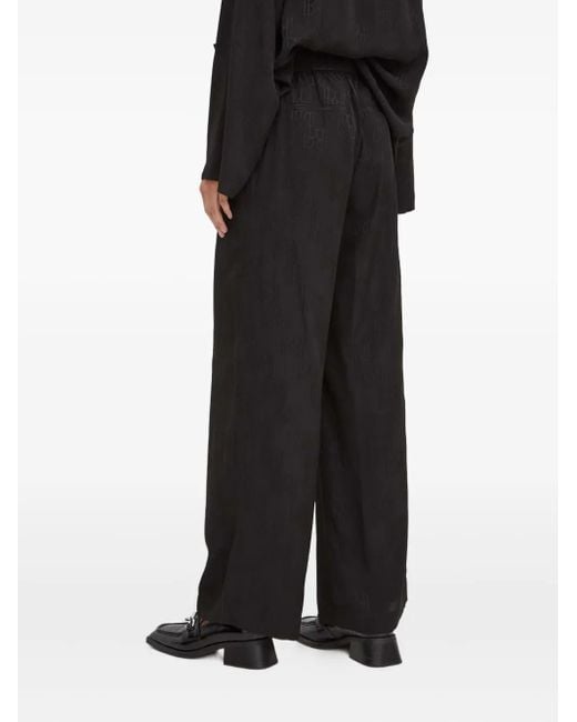 Herskind Black Monogram-Pattern Trousers