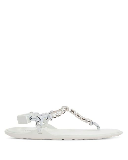 Crystal-embellished thong sandals di Miu Miu in White