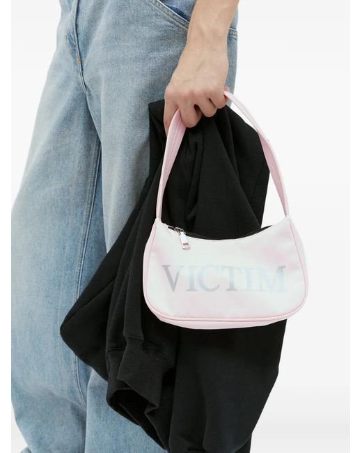 PRAYING Black Victim Graphic-Print Shoulder Bag