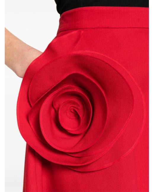 Jupe évasée à appliques fleurs Valentino Garavani en coloris Red