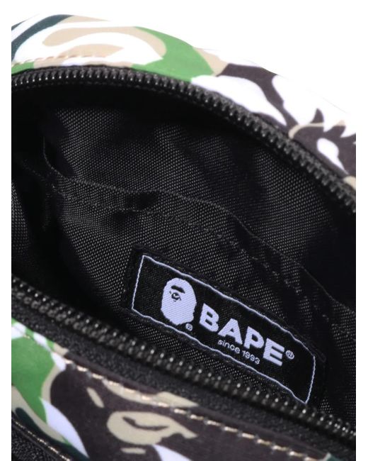 A Bathing Ape Black Hibiscus-Print Camouflage Messenger Bag for men